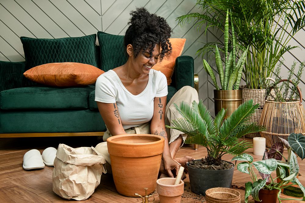 Woman repotting plants in the new normal