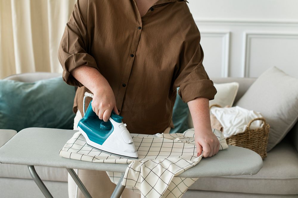 Woman ironing a shirt laundry house chores
