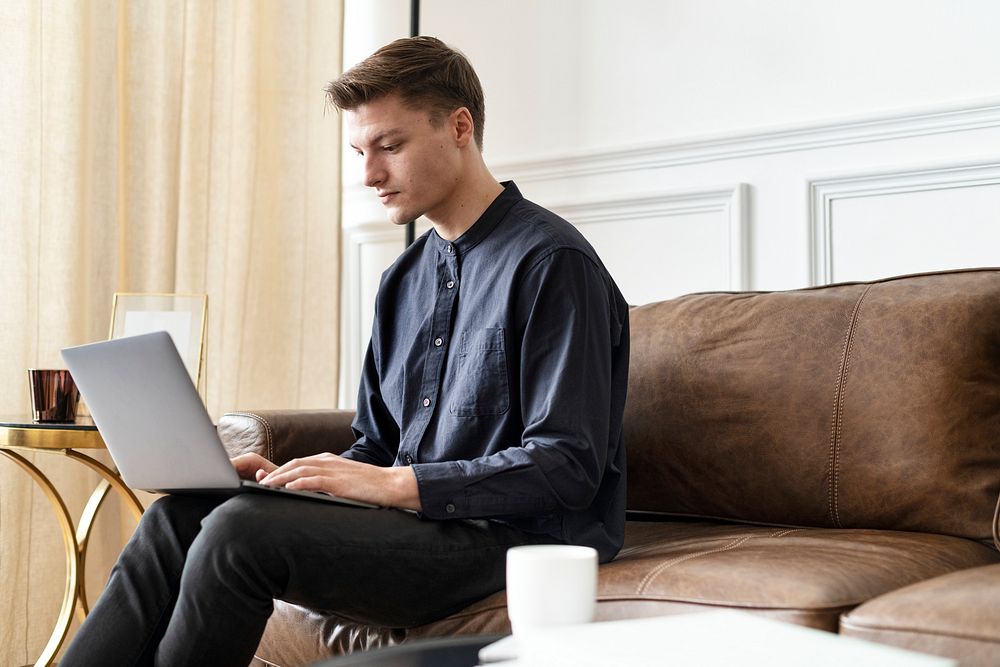 Man using a laptop and working from home