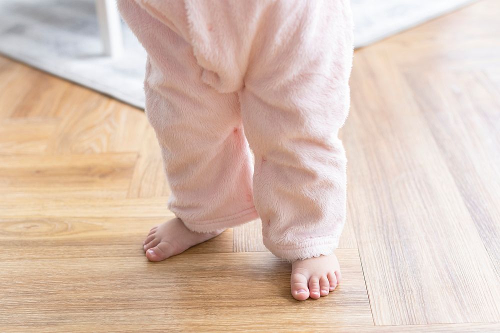 Baby's first steps with cute little feet