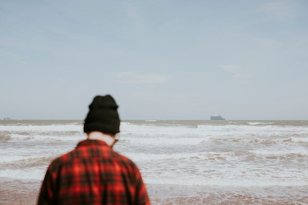 Man by the sea in wales, UK