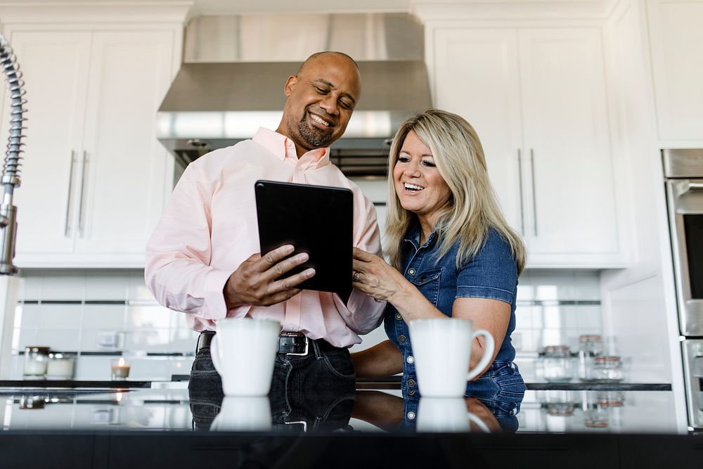 Husband and wife couple using a digital tablet