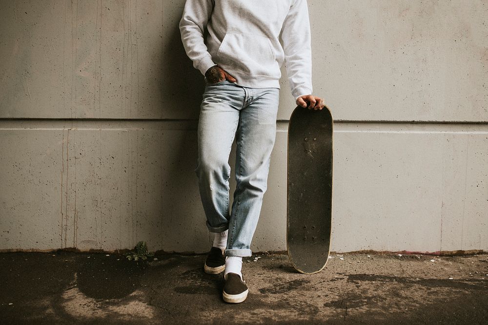 Streetwear fashion man with a skateboard 