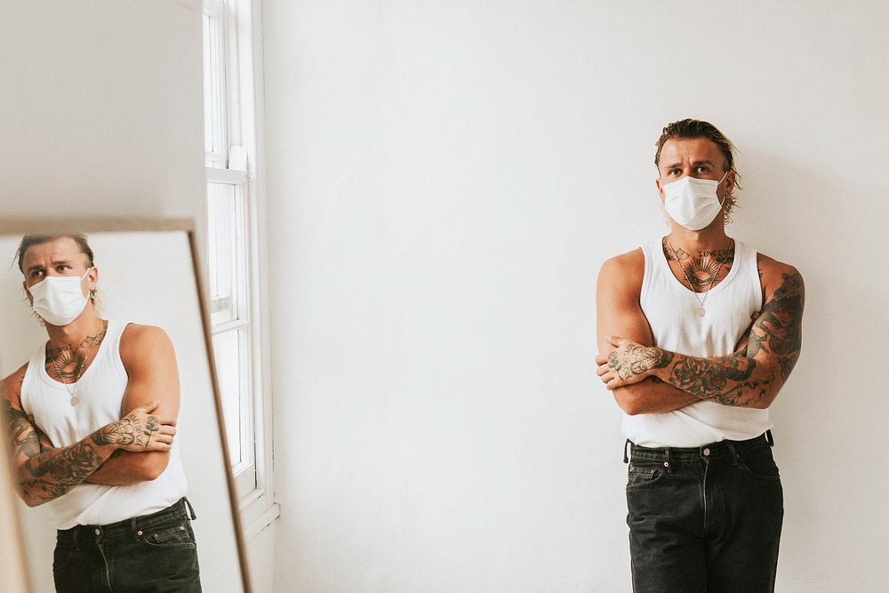 Tattooed man wearing a face mask mockup in the new normal