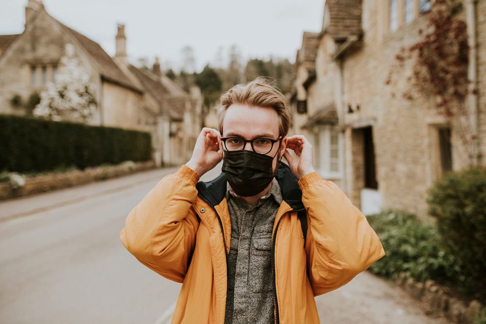 Man wearing mask in the new normal in Cotswolds, UK