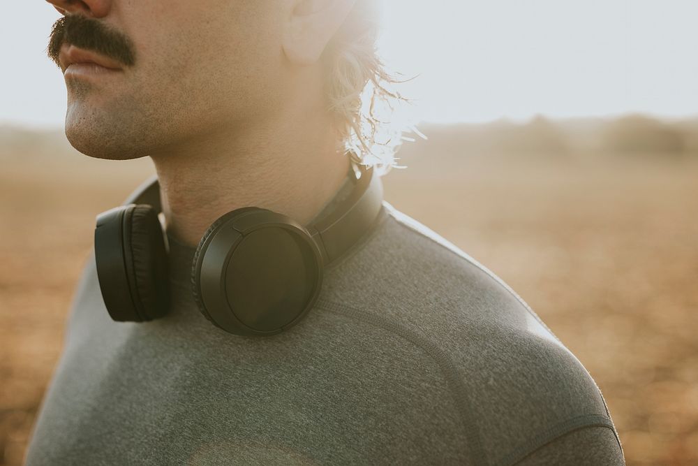 Man with  headphones around his neck closeup