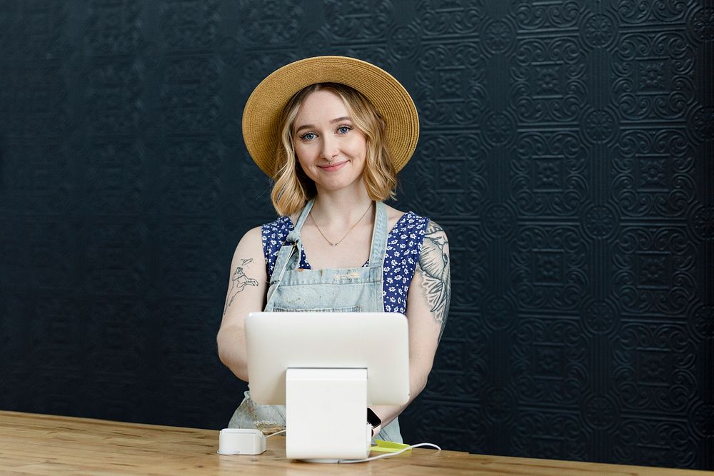 Small business owner at a cash register