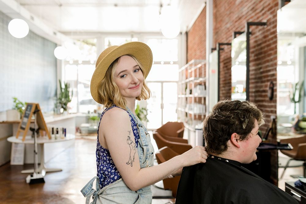 Hairstylist set the customer's hair in a perm