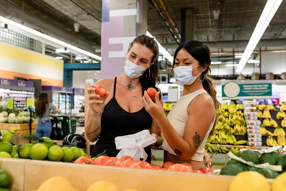 Lesbian couple shopping at a supermarket