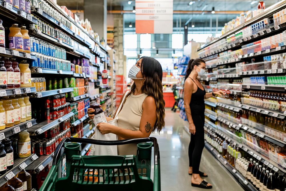 Woman grocery shopping, supermarket stock photo