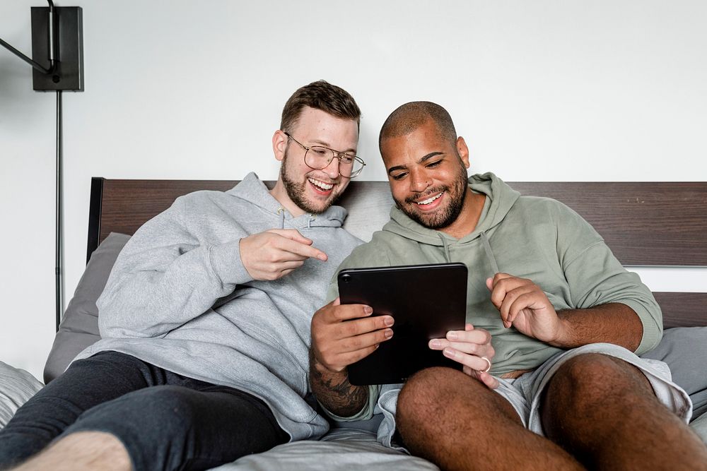 Happy gay couple image, video calling with friends