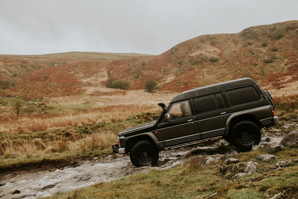 Car stuck in a stream waiting for rescue