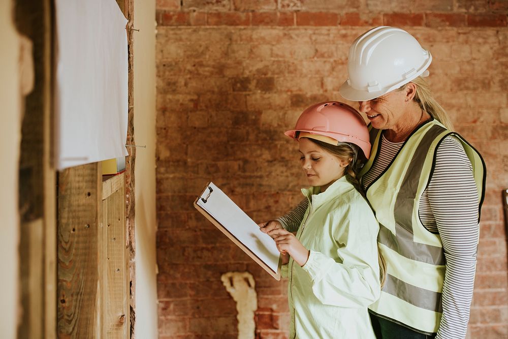 Daughter learning contractor work from mother