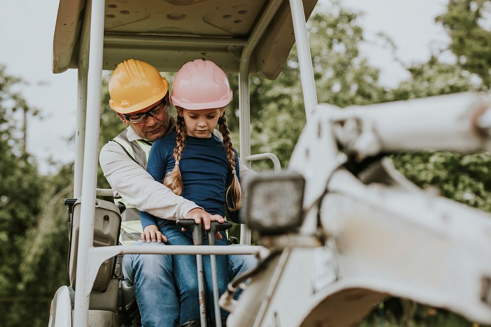 Father teaching daughter at a construction site