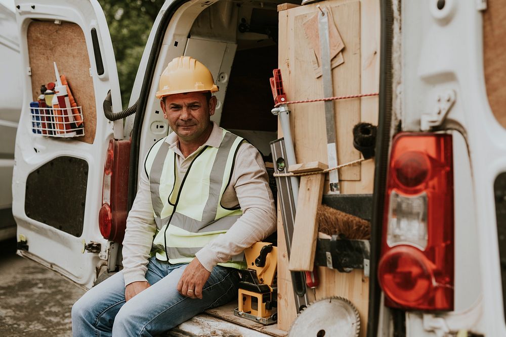 Construction worker taking a break on a van