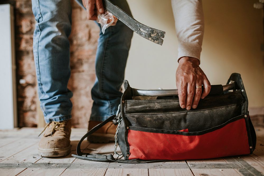 Home technician take out equipment from his bag