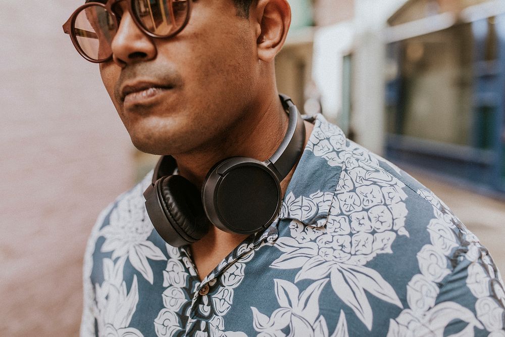 Man with headphones in hawaiian shirt 