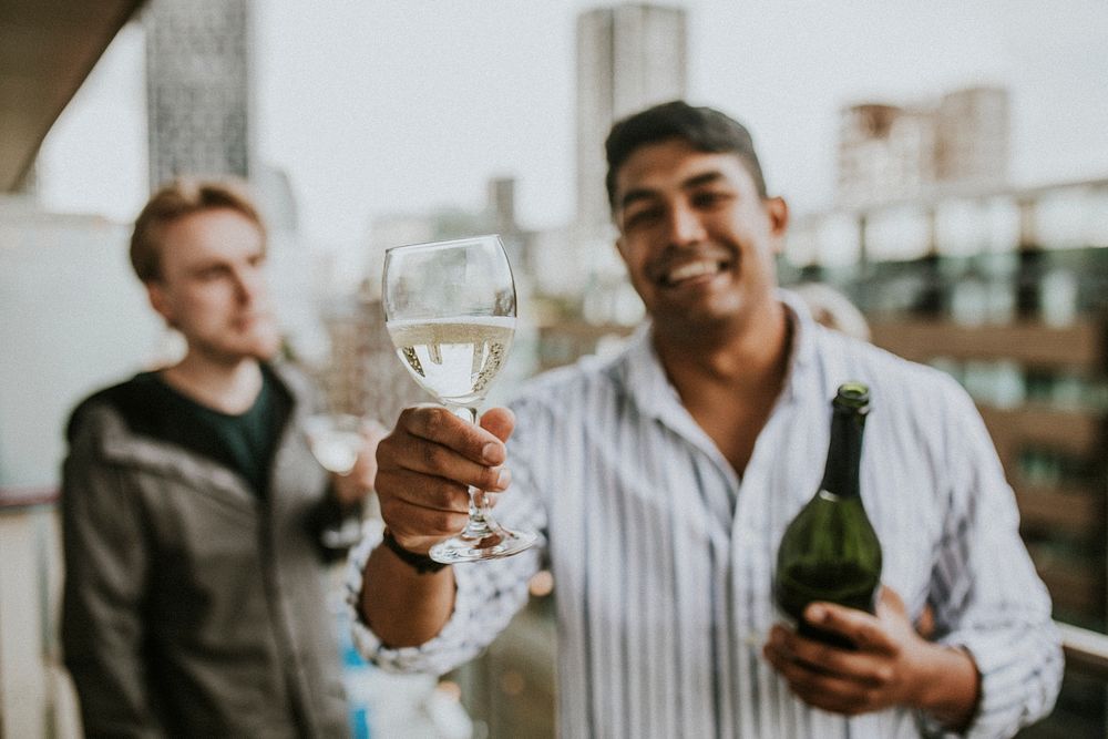 Friends celebrating and toasting on a rooftop