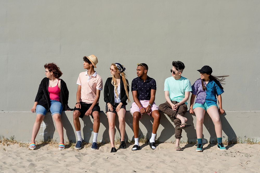 Teens looking left, friends in summer beach
