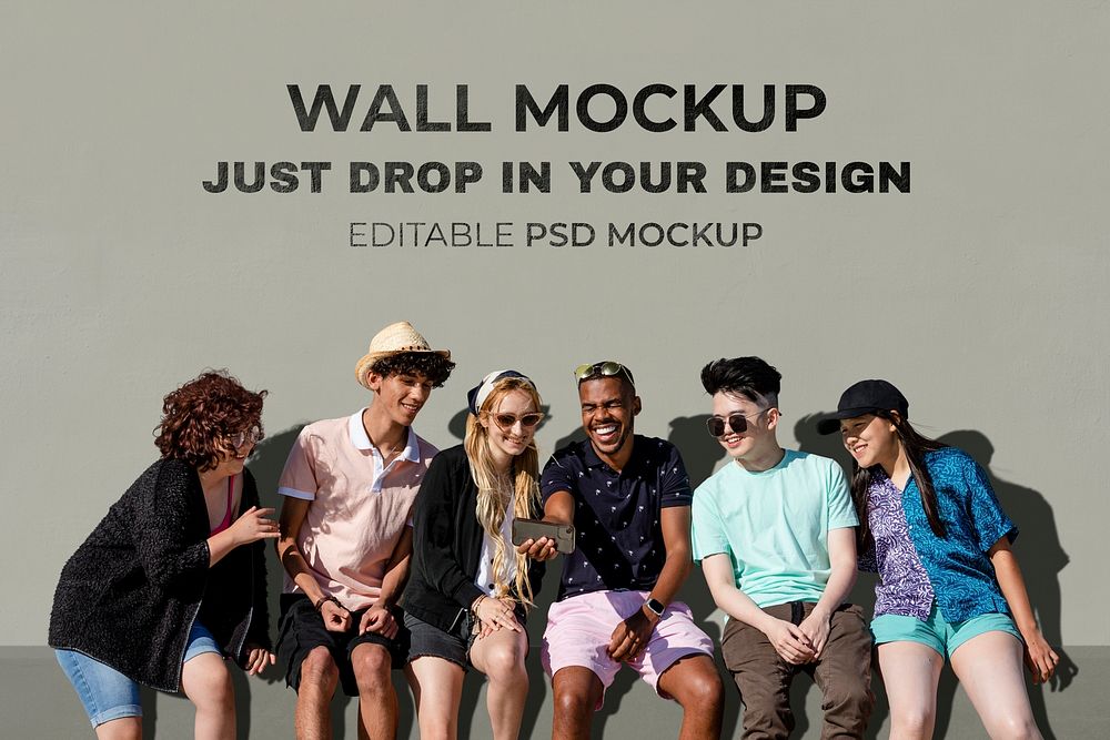Wall mockup psd, teen friends watching a video on a smartphone