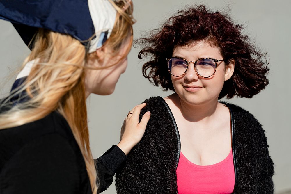 Teen comforting friend, youth mental health social issue