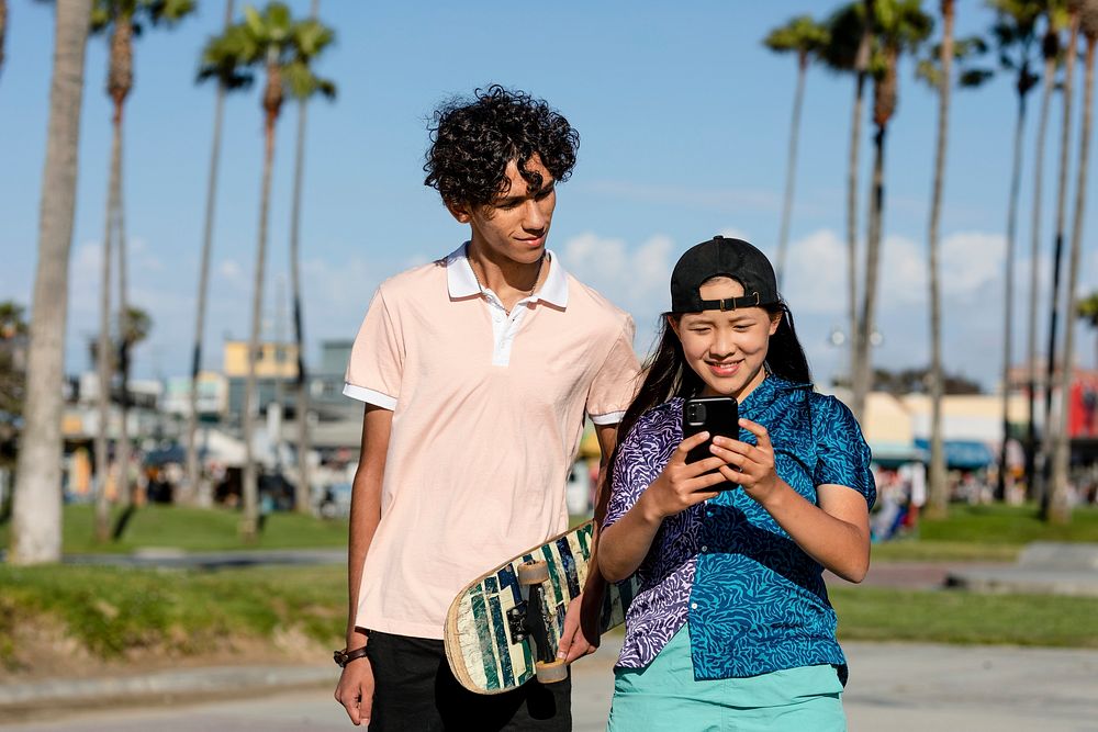 Cute teen couple take a selfie, summer in Venice Beach, Los Angeles