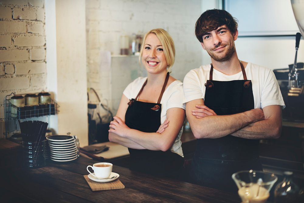 Cafe staff posing with arms crossed