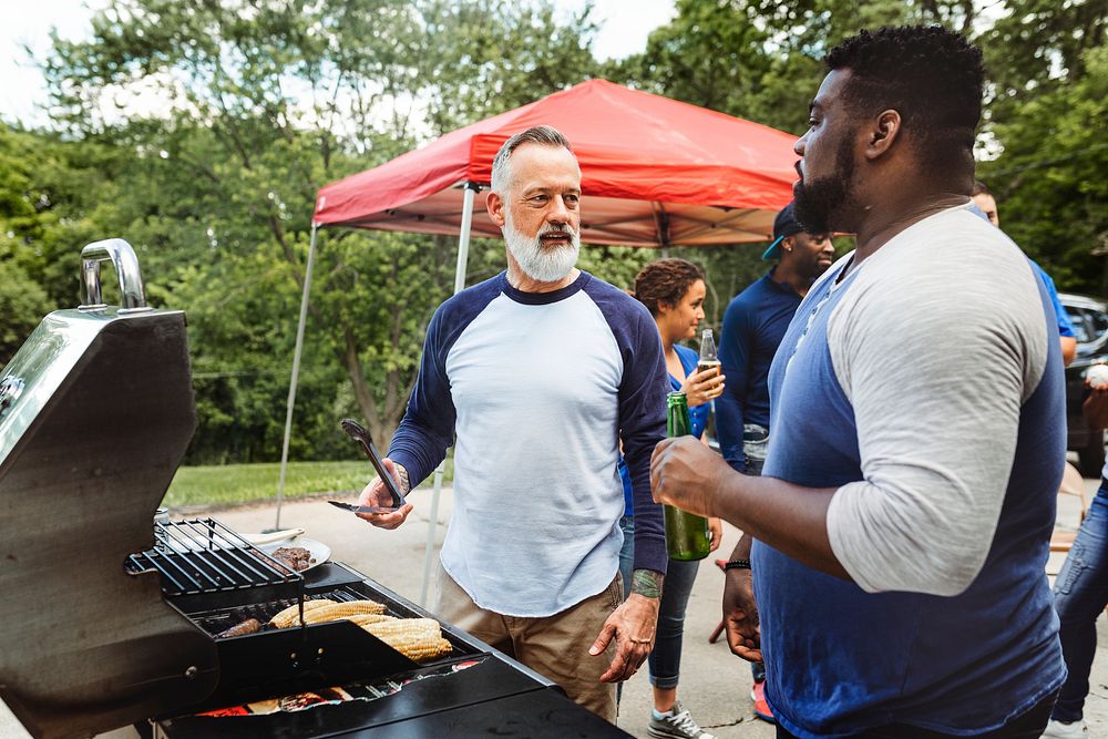 Manning the grill at a tailgate party