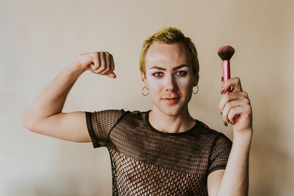 Non-binary beauty blogger with makeup tools