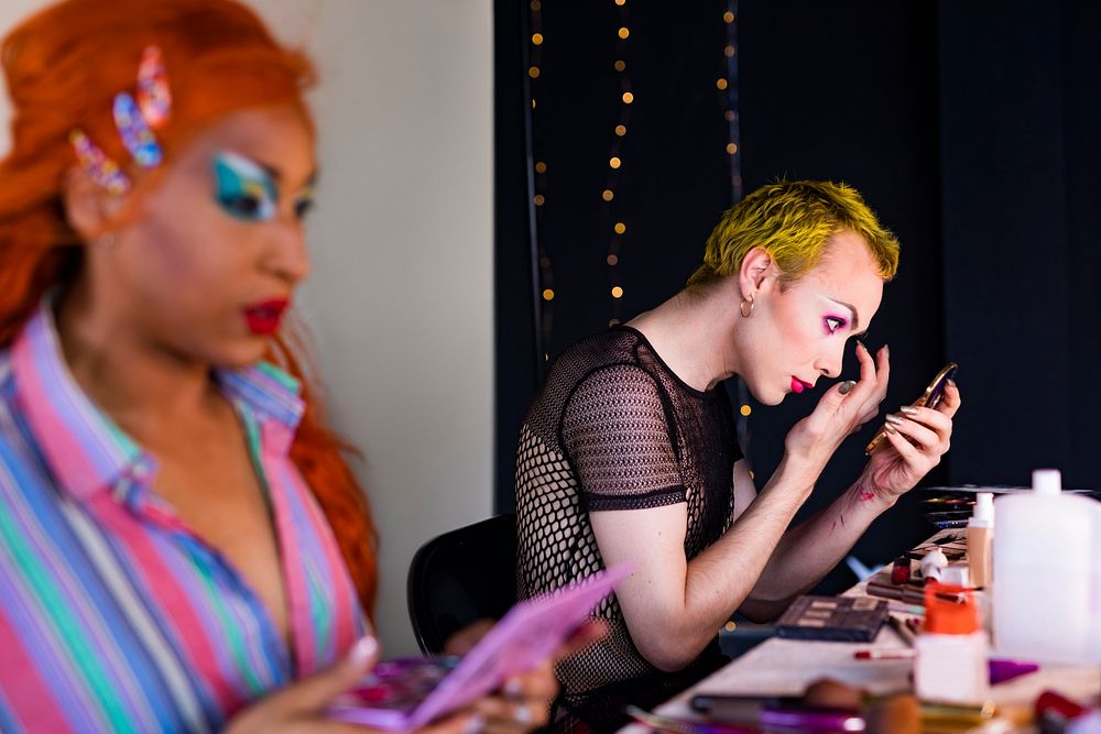 Drag show artist applying makeup, getting ready for a show