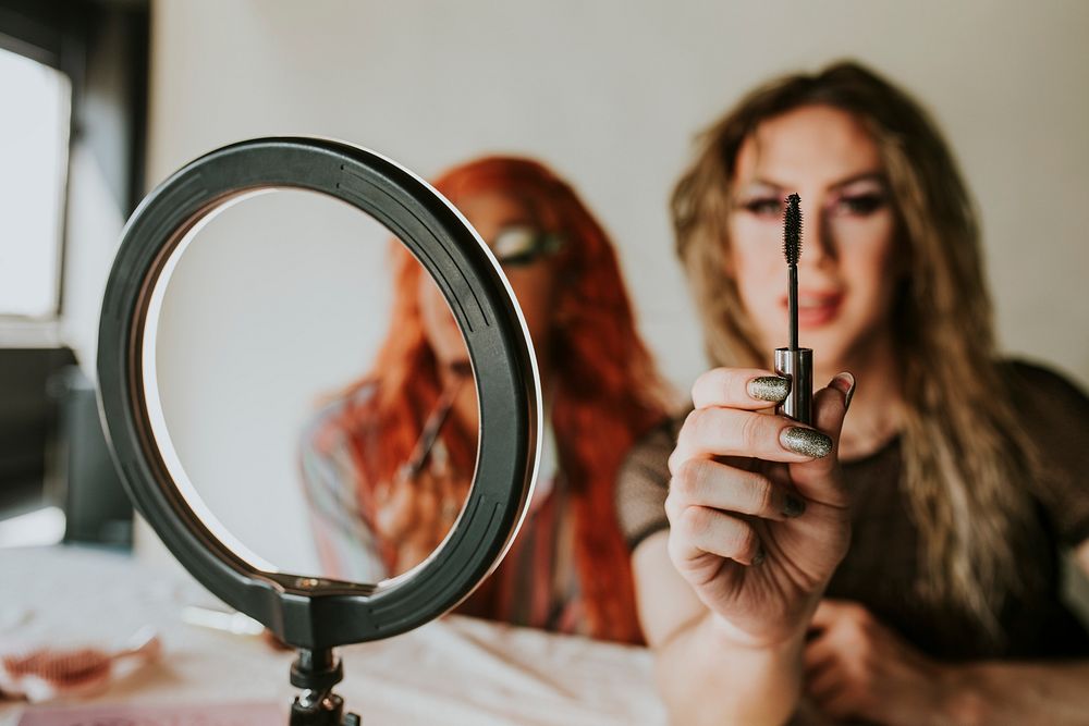 Drag queen beauty blogger recording a makeup tutorial video