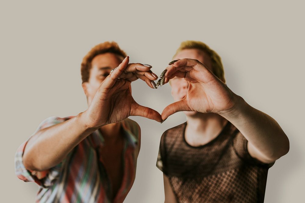 Gay couple psd making heart shaped-hands, gender equality
