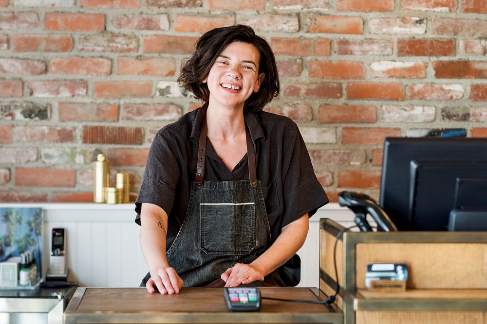 Small business owner at a cash register