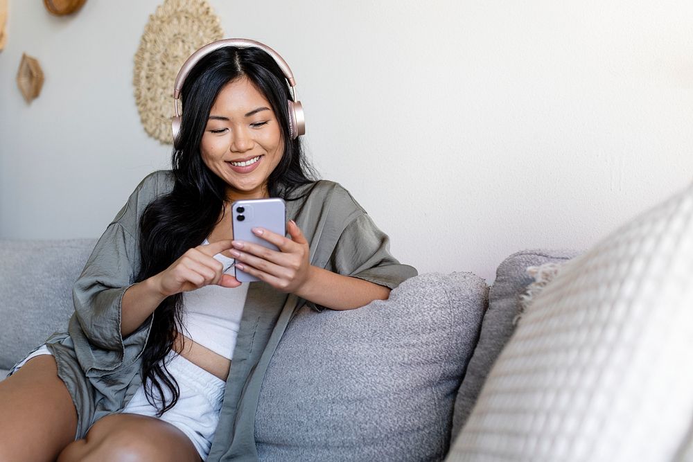 Woman listening to podcast in headphones