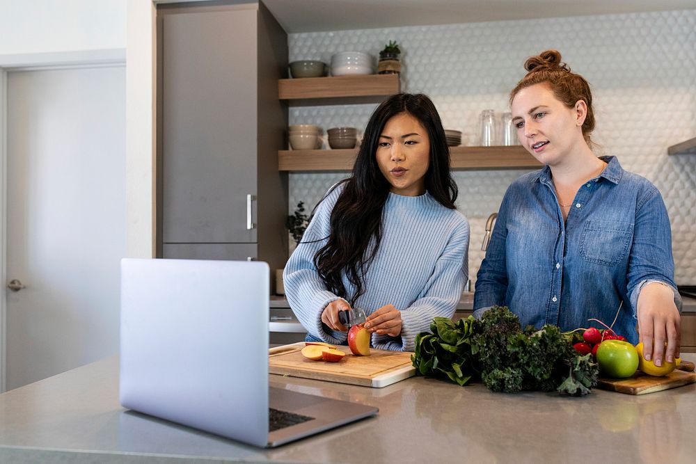 Virtual cooking class through laptop in kitchen