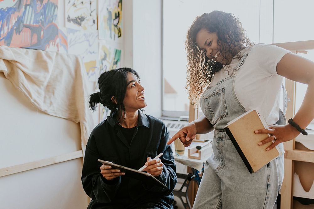 Woman artists collaborating together in their art studio