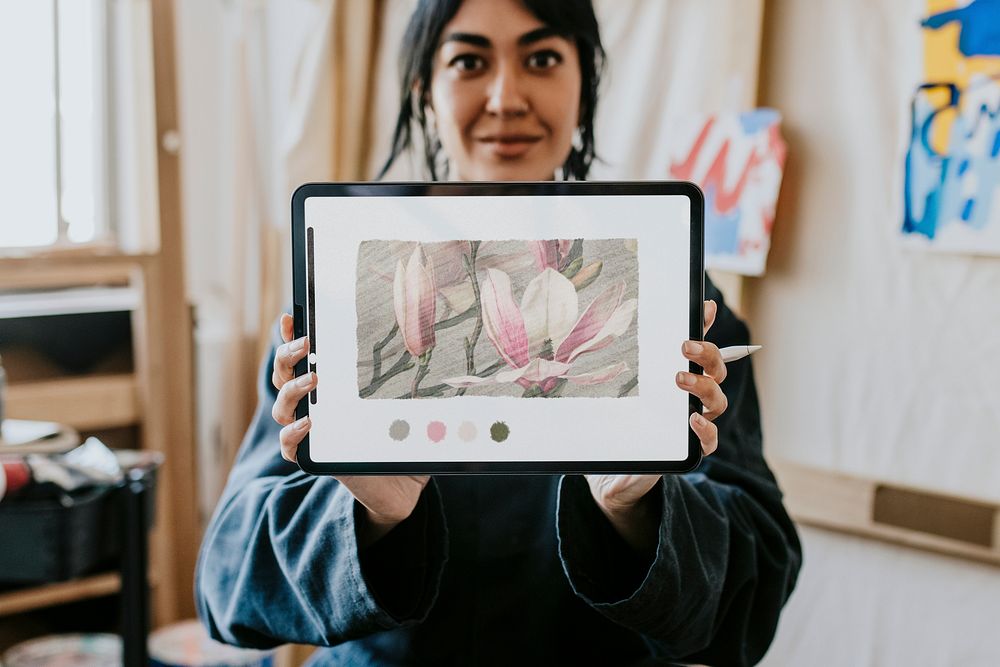 Digital tablet screen mockup psd, woman artist showing her own drawing on the tablet 