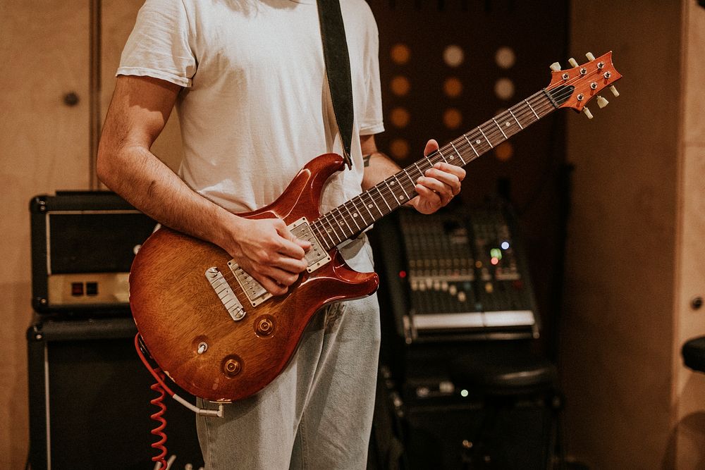 Musician playing guitar aesthetic photography