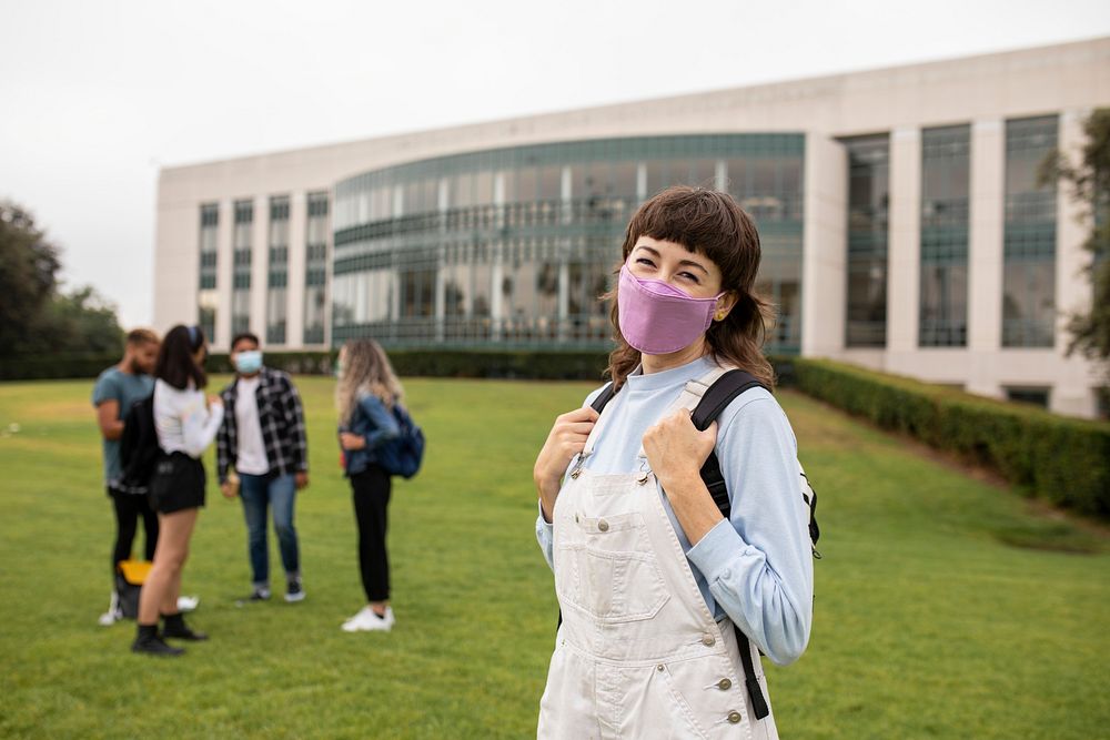 Girl wearing mask at campus in the new normal