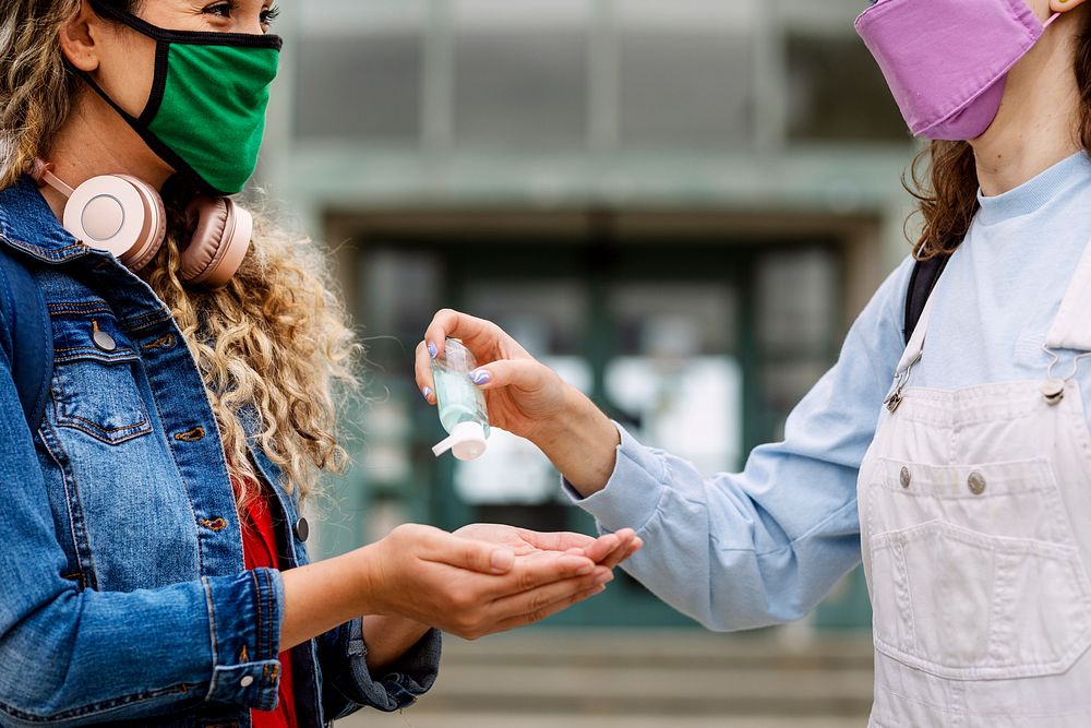 Students wearing mask at school, and using alcohol gel in the new normal 