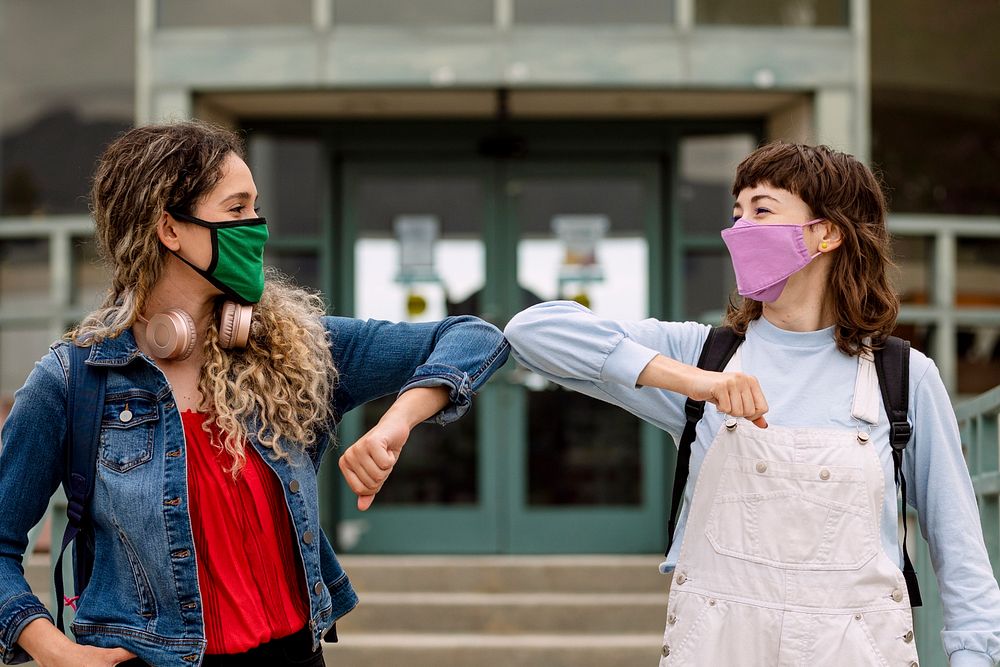 Face mask mockup psd, students at school elbow bumping in the new normal