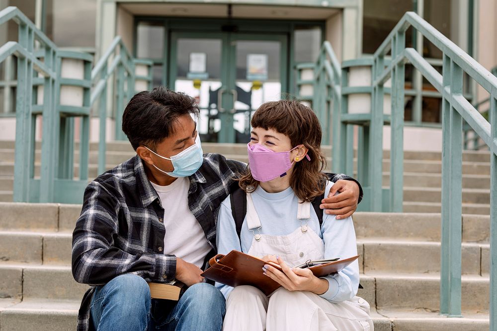 Couple wearing face mask at school in the new normal