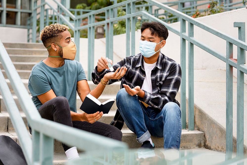 Students wearing mask at school, and using alcohol gel in the new normal 