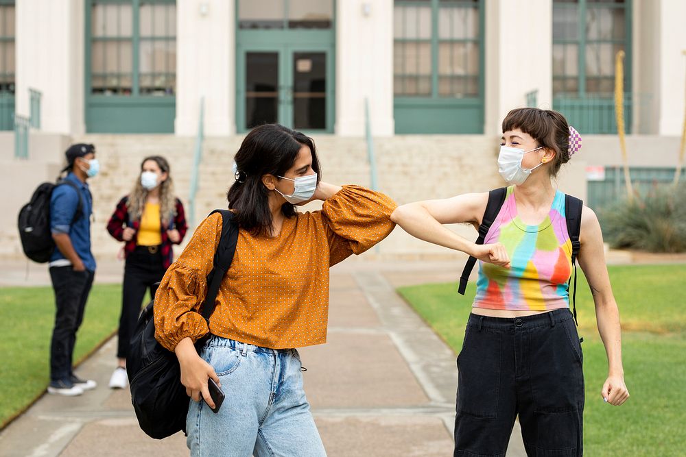 Elbow bump greeting at school in the new normal