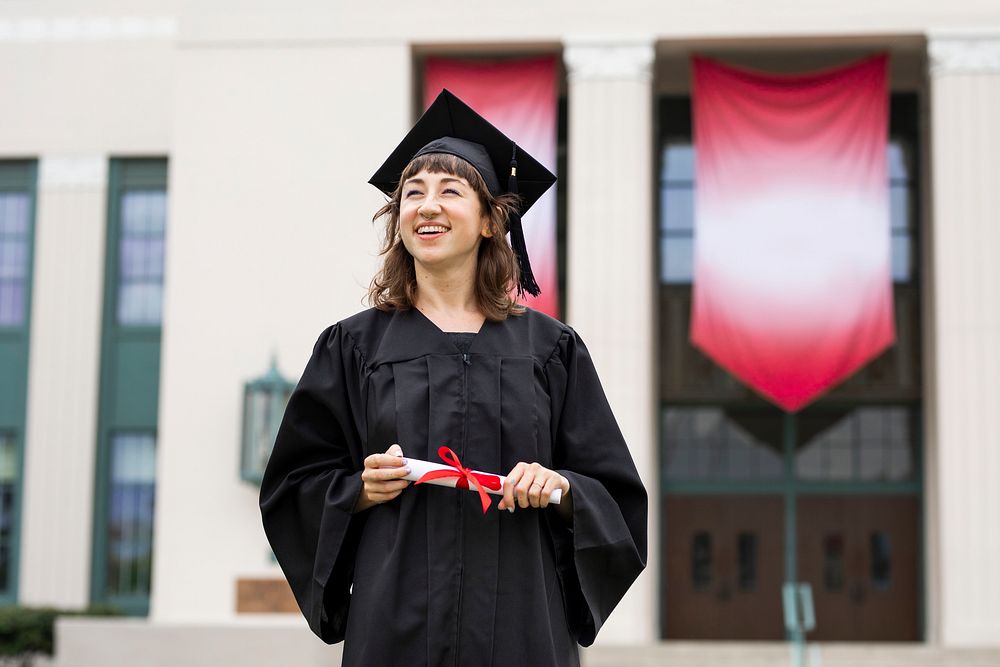 Girl graduating college, celebrating academic achievement 