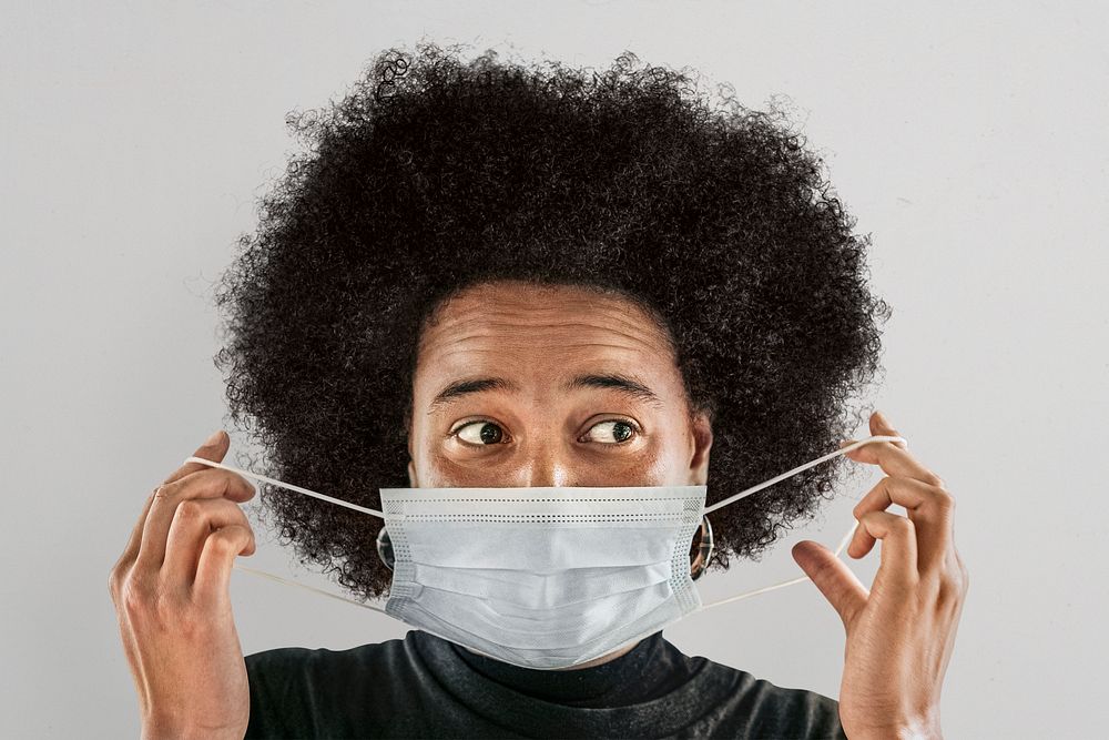 Woman putting on surgical mask psd, new normal lifestyle