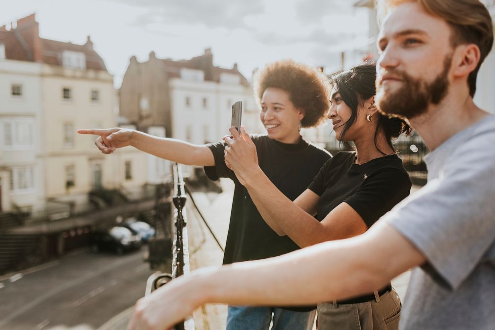 Three friends sightseeing in the city