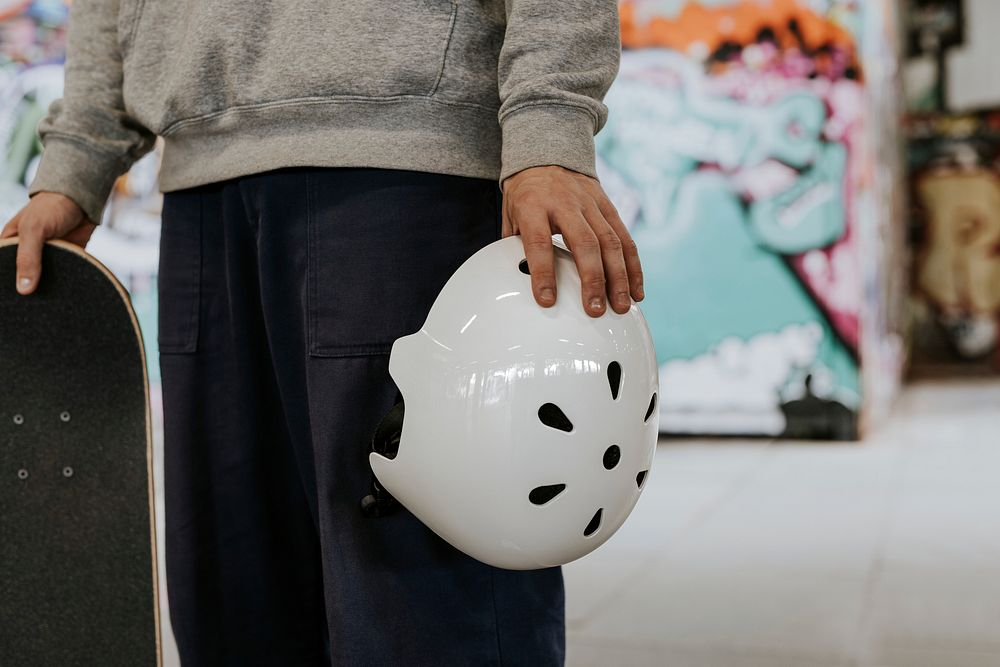 Skater holding white helmet at skate Premium Photo rawpixel