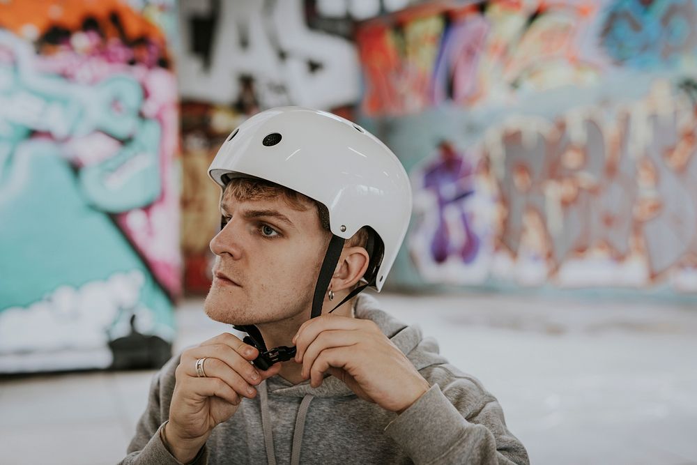 Skater wearing white helmet for safety