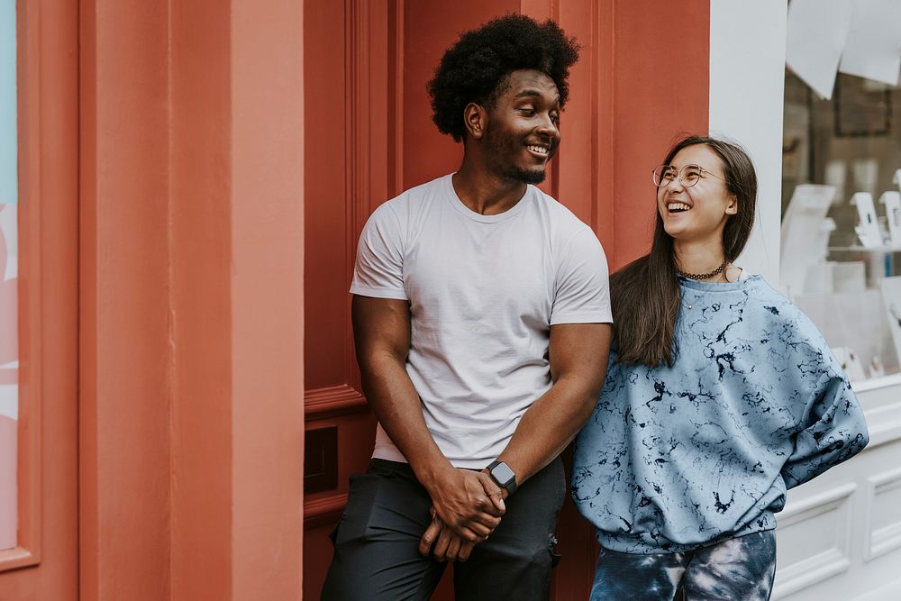 Diverse friends hanging out in city